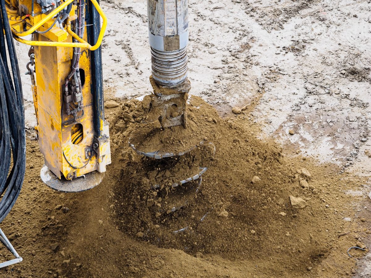 Drilling rig taking soil samples for testing