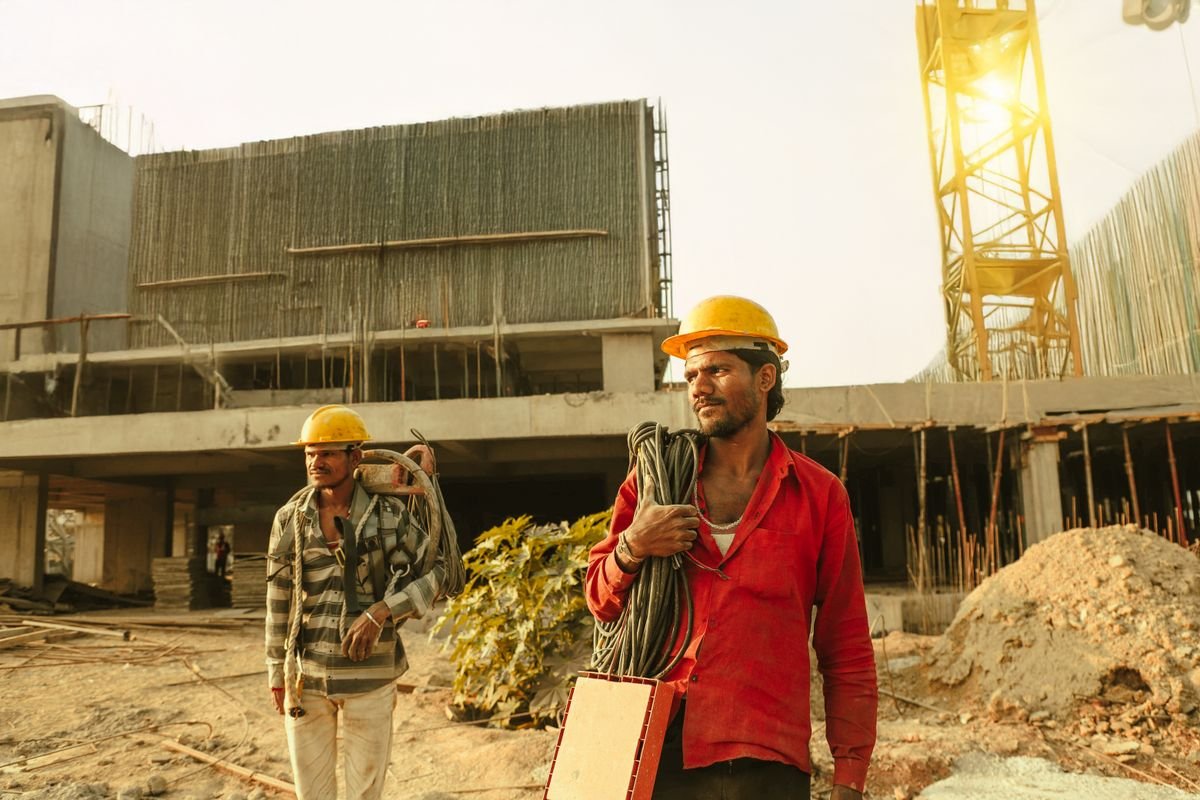 Site crew in hard hats coordinating work on a project