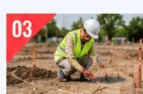 Worker marking building setting-out lines on site